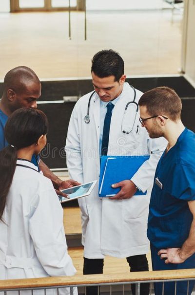 Group of Doctors in an Impromptu Meeting Stock Photo - Image of medicine, hospital_ 71090198